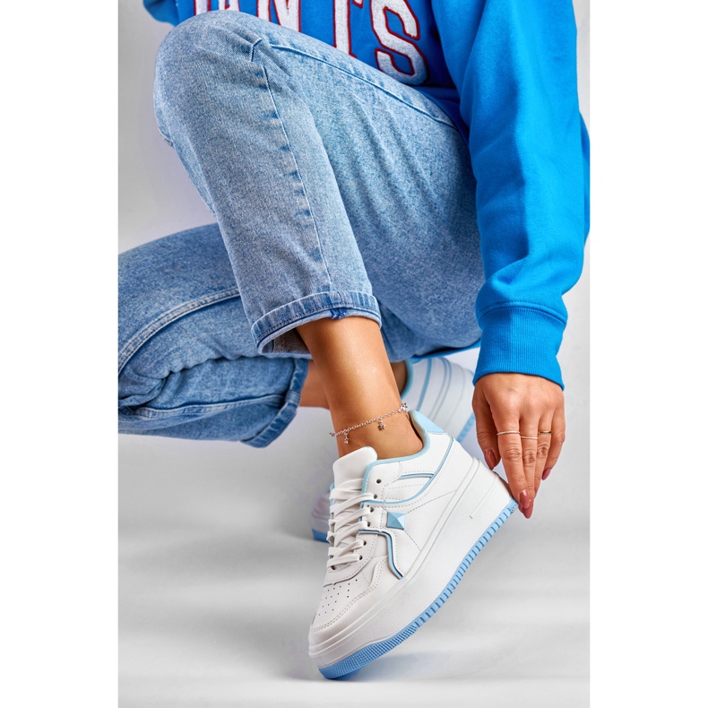 Women's white sneakers with blue accessories 1