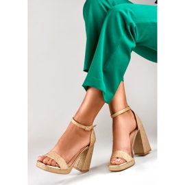 Gold shiny sandals on a wide high heel golden 1