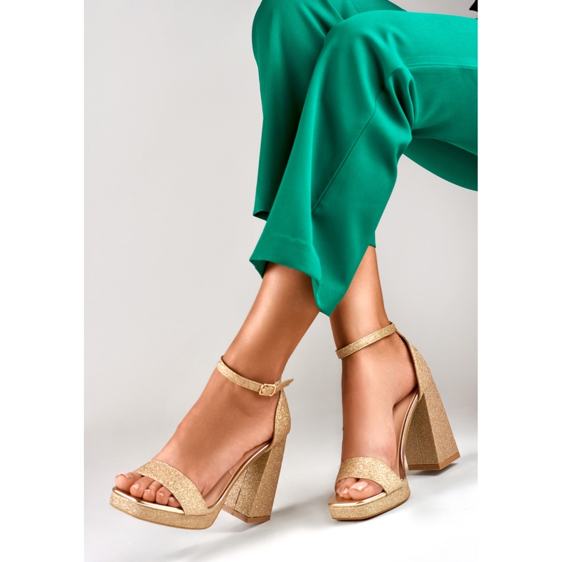Gold shiny sandals on a wide high heel golden 1