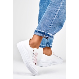 Women's white sneakers on the platform 1