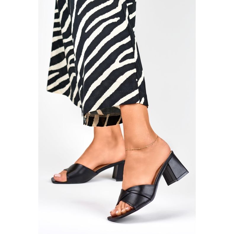 Women's black slippers on a low heel 1