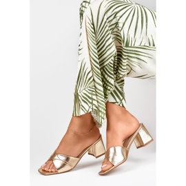 Women's golden slippers on a low heel 1