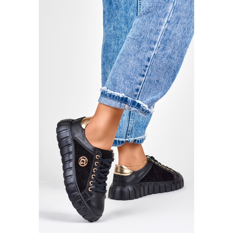 Black leather sports shoes with gold details 1