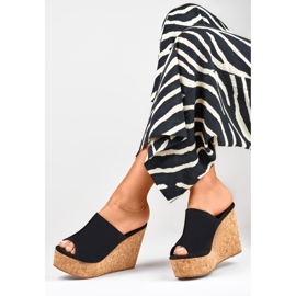Black flip flops on a cork wedge 2