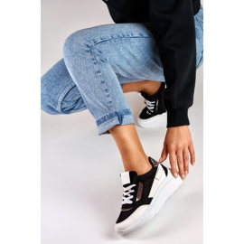 Black sports shoes with a white sole 1