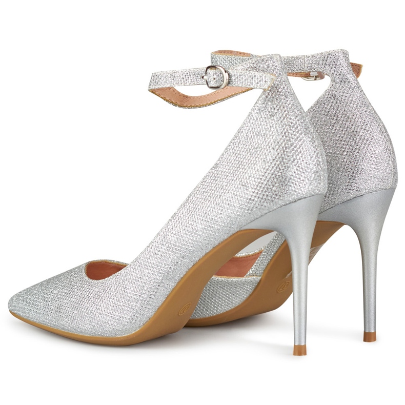 Shiny silver pins fastened at the ankle 1