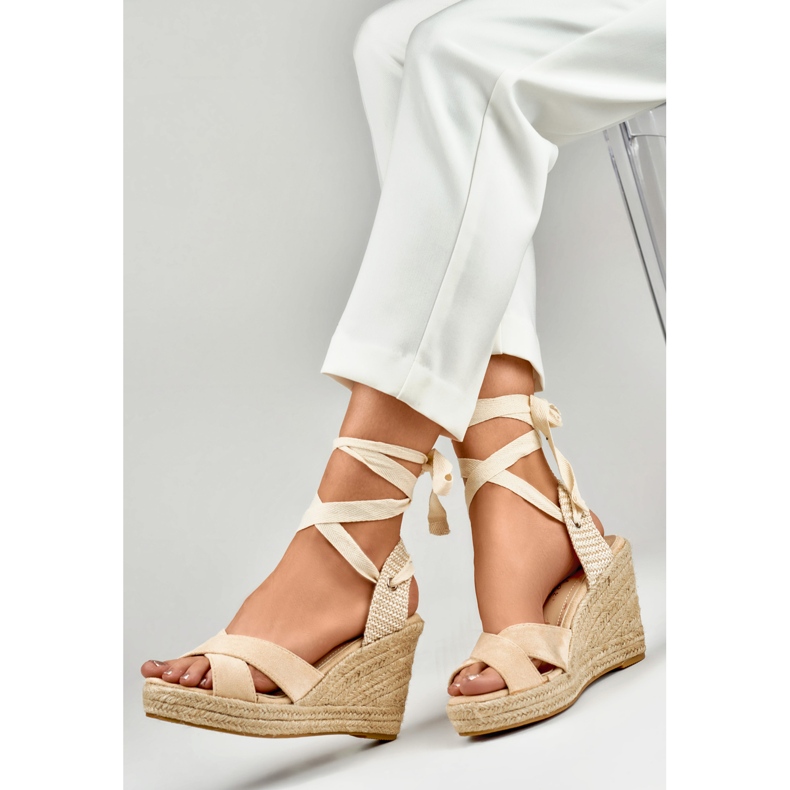 Beige women's sandals on the platform 1