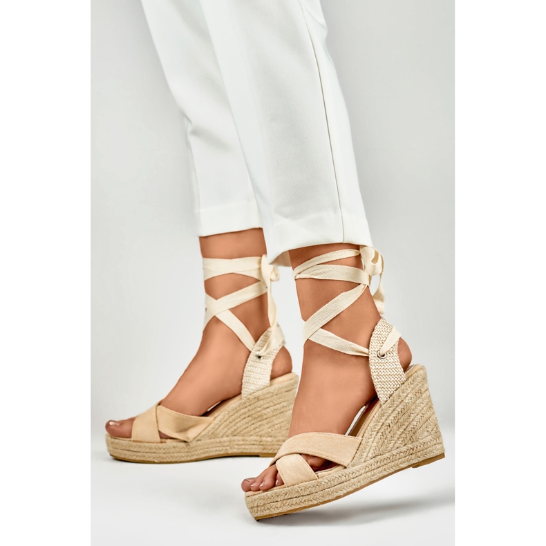 Beige women's sandals on the platform 2