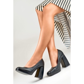 Black pumps on a wide high heel 1