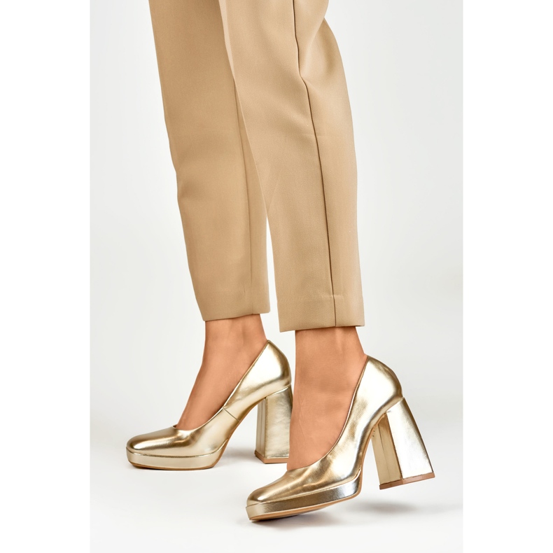 Gold pumps on a wide high heel golden 2