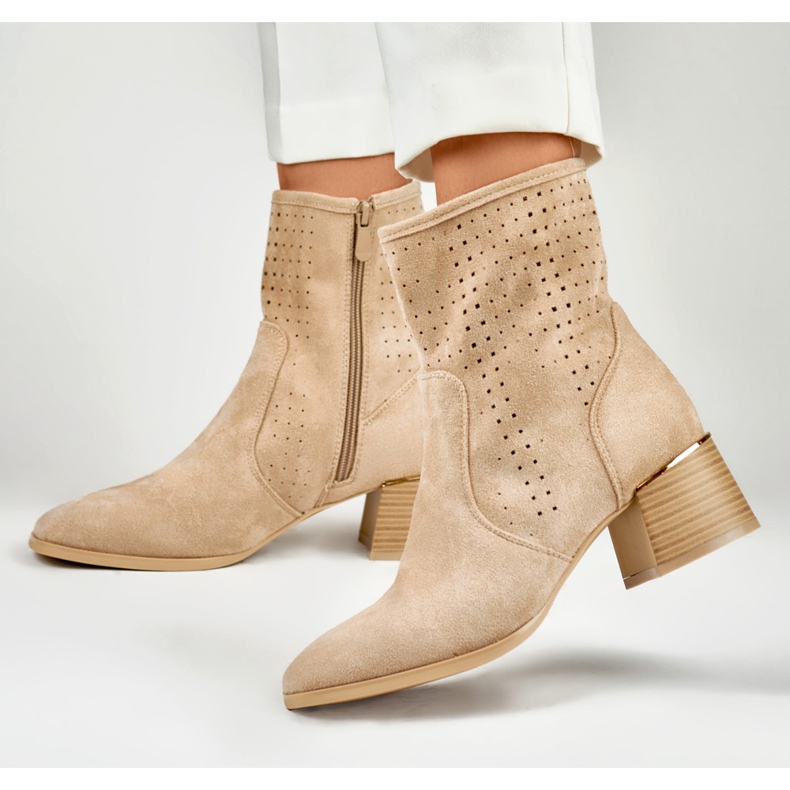 Light beige openwork women's boots on a low heel 2