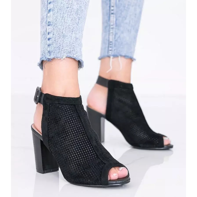 Black openwork sandals on the Veronika post 1