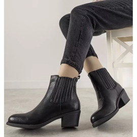 Black slip-on ankle boots on the Pena post 1