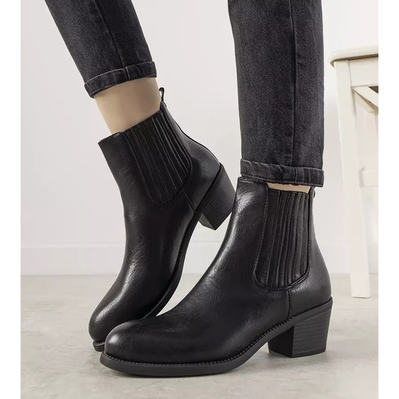 Black slip-on ankle boots on the Pena post 2