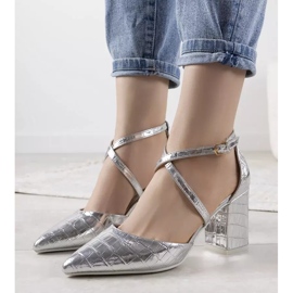 Silver pumps on a Strutt post 1