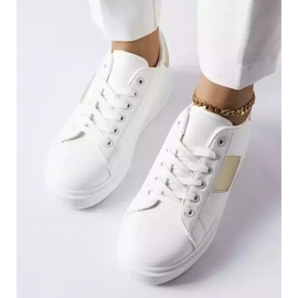 White sneakers with a gold stripe from Aurélie 2