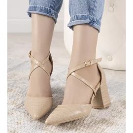 Beige pumps on a Strutt post 2