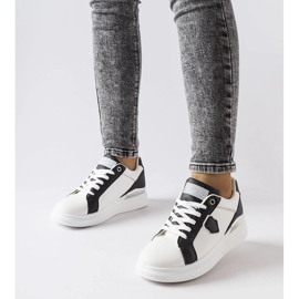 White and black sneakers with a silver accent from Via 1