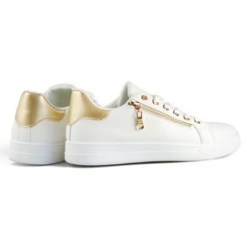White sports shoes with a gold zipper 1