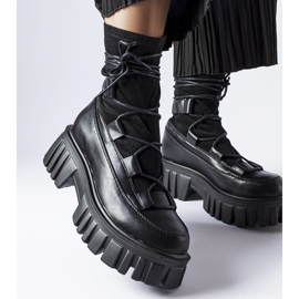 Black sock boots with a Colce tread 1