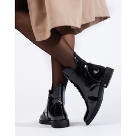 W. Potocki Black patent ankle boots with a flat heel by Potocki 1