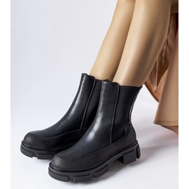 Black ankle boots with an elastic upper by Faisal 1