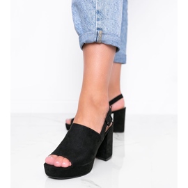 Black sandals on the post of Chikie 1