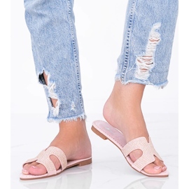 Tough studs on pink flip-flops 1