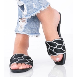 Black slippers with a decorative Stormi upper 1