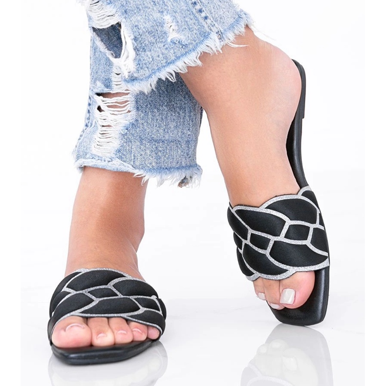 Black slippers with a decorative Stormi upper 1