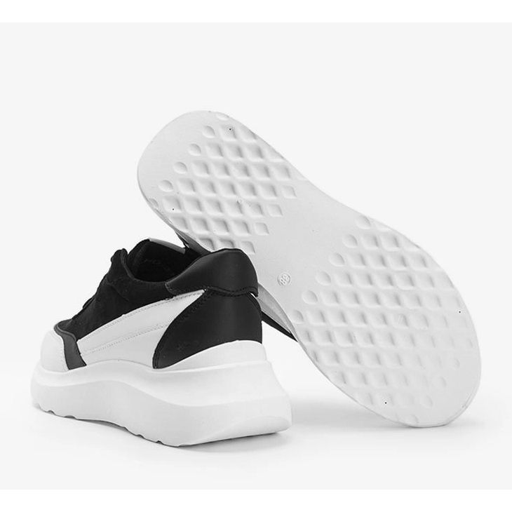 Black sneakers with white details on a Barteks high sole 1