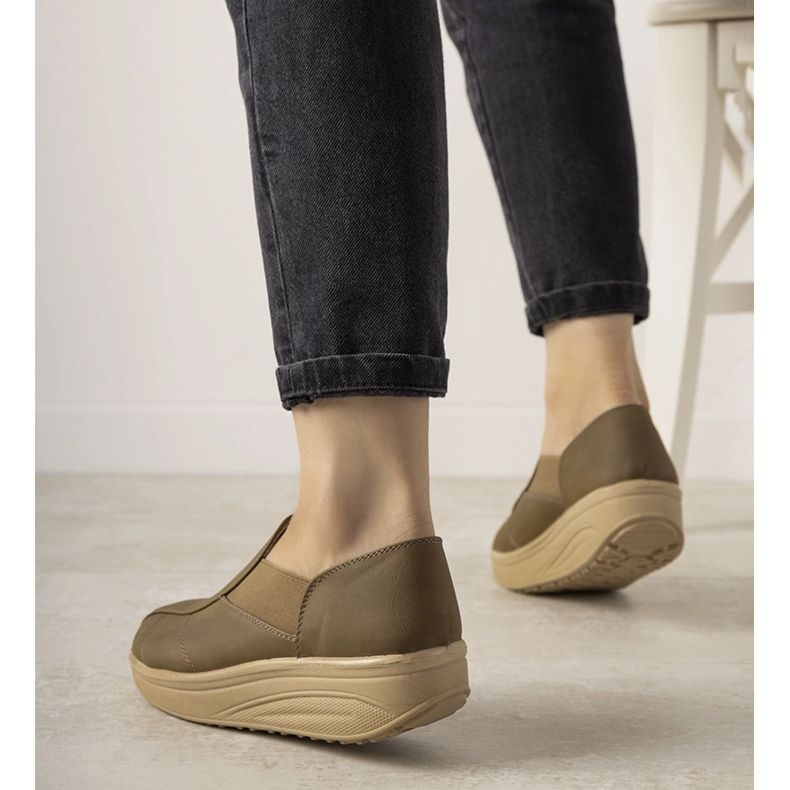 Brown shoes with a high sole from Spike 1