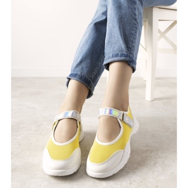 Yellow and white trainers with a holographic Melania insert 1