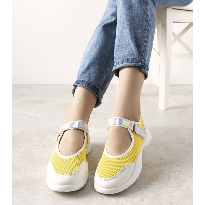 Yellow and white trainers with a holographic Melania insert 1