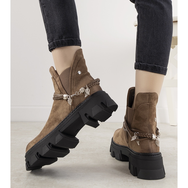 Brown boots with a Fearless bracelet 1