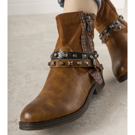 Brown boots with a studded Elffie headband 2