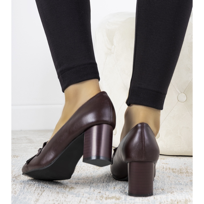 Maroon pumps on a post made of Alice's eco-leather red 1