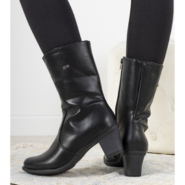 Black classic boots on the Preciado post 1