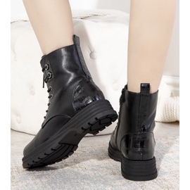 Black insulated boots on a high Dora sole 1