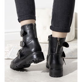 Black padded boots with a decorative zipper 1