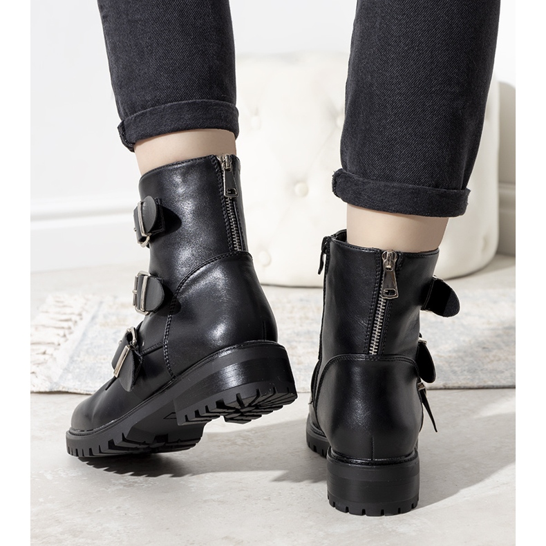 Black padded boots with a decorative zipper 1