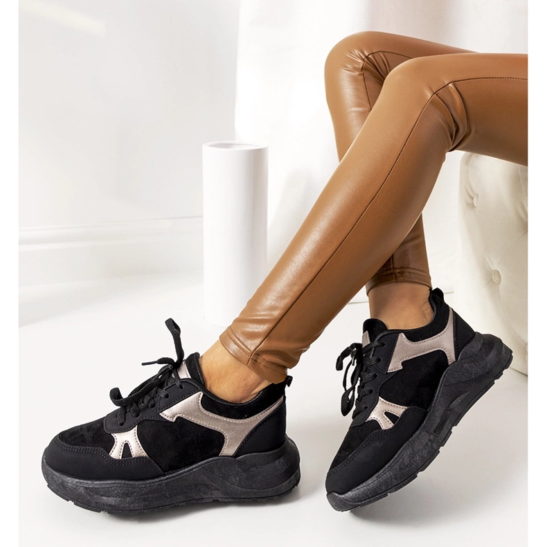 Black sneakers with golden Davis accents 1