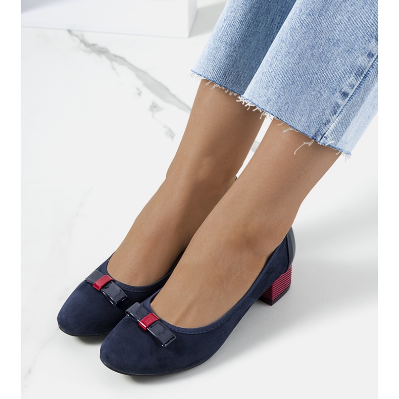 Navy blue pumps with a Deniz bow red 1