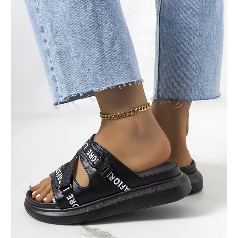 Black slippers on the platform 1