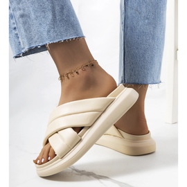 Beige slippers on the Allport platform 1