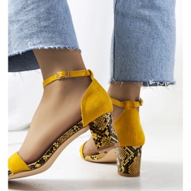 Yellow sandals on the post with the Azevedo snake motif 1