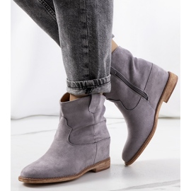 Gray boots on an indoor Hunjet wedge heel grey 1