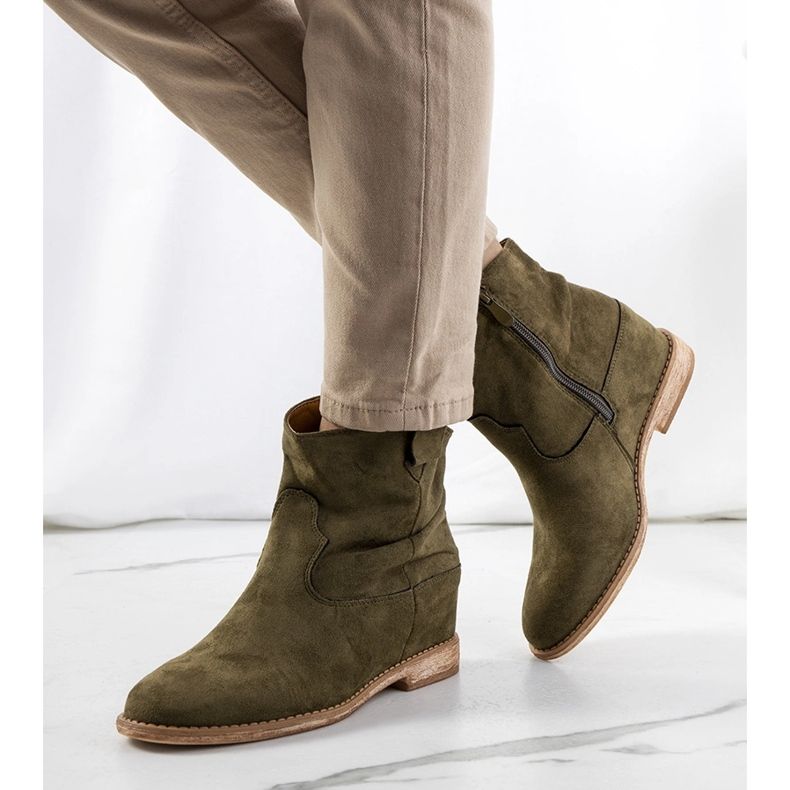 Green boots on an indoor Hunjet wedge heel 1