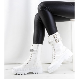 White sneakers with a Taus chain 1