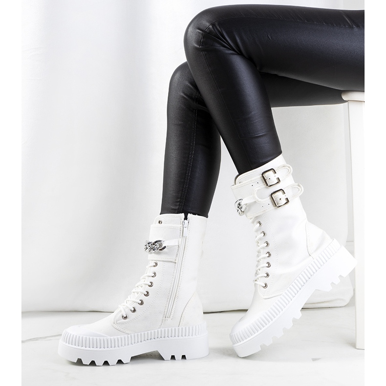 White sneakers with a Taus chain 1